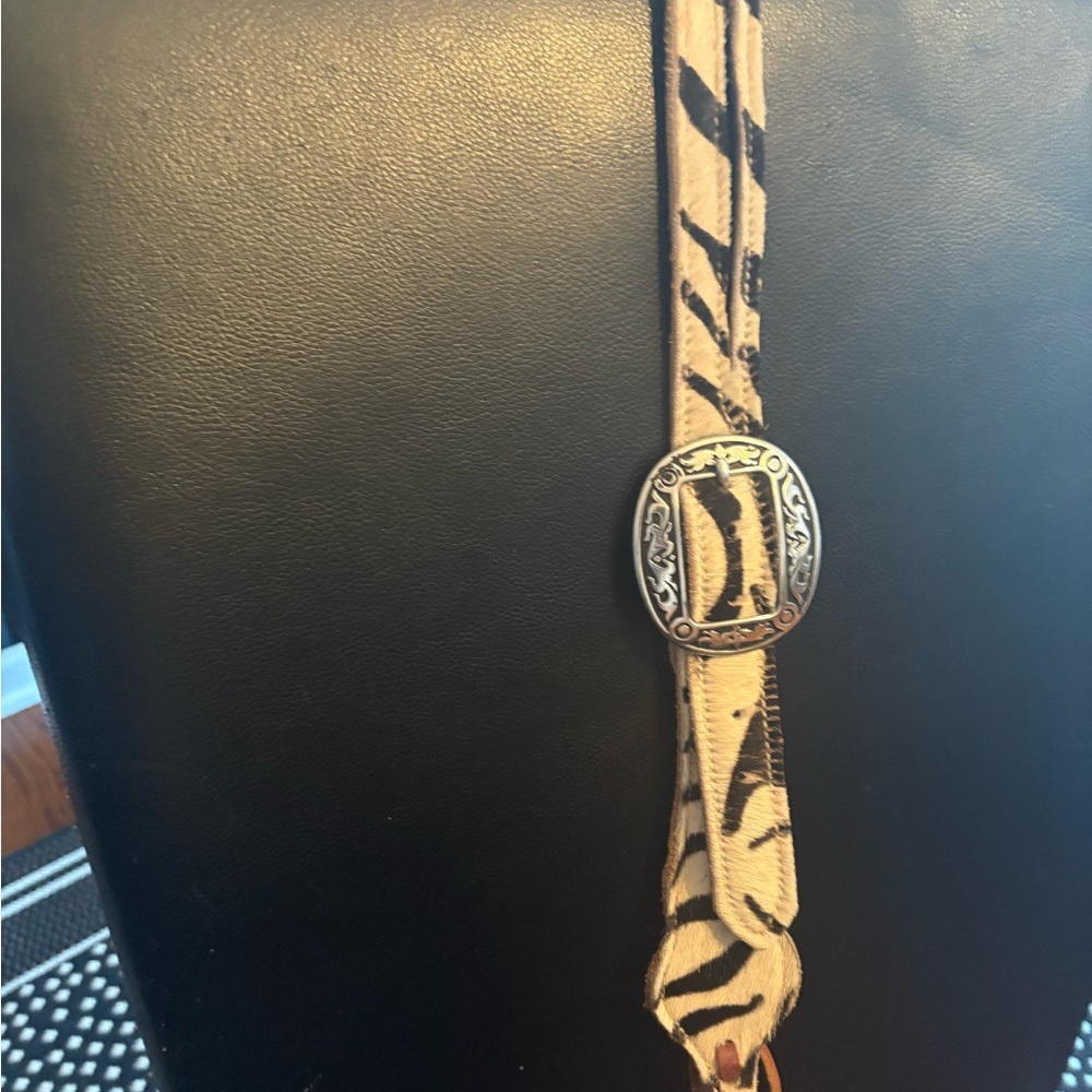 Belt style heads tall bridle. Used but looks great. Zebra hair on .